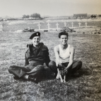 Gordon Victor Haunts (left) and Thomas B. Sheridan having a break in company of a dog